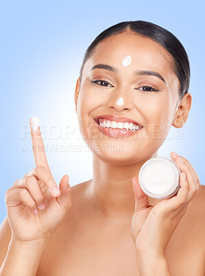 Buy stock photo Portrait, happy woman and jar of face cream in studio for dermatology, glowing skincare and advertising lotion on blue background. Model, facial beauty or moisturizer container of sunscreen cosmetics