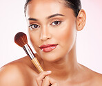 Cosmetic brush, portrait and woman for glow, beauty and face makeup treatment with tool. Skin, natural and headshot of young Indian female model with cosmetology product isolated by studio background