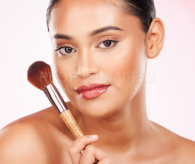 Buy stock photo Cosmetic brush, portrait and woman for glow, beauty and face makeup treatment with tool. Skin, natural and headshot of young Indian female model with cosmetology product isolated by studio background