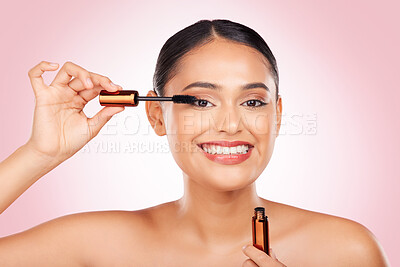 Buy stock photo Portrait, smile and a woman with mascara on a pink background for eyelash beauty in studio. Smile, young and a female model marketing a cosmetics product for facial glow, skincare or wellness