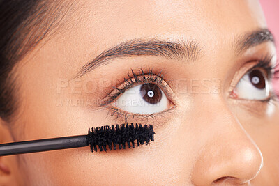 Buy stock photo Mascara brush, eyes and face of woman with studio cosmetics tools, skincare wellness and grooming lashes. Closeup, salon cosmetology or self care person with eyelash makeup product on pink background