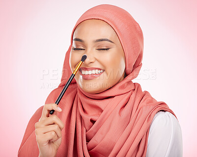 Buy stock photo Makeup brush, relax face and happy Muslim woman with studio cosmetics tools, wellness routine or skincare shine. Product application, eyes closed and Arabic person with self care on pink background