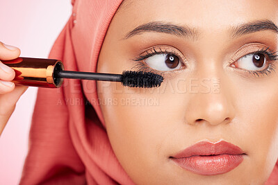 Buy stock photo Mascara brush, beauty and face of Muslim woman with studio cosmetics tools, skincare wellness and grooming lashes. Eyelash product, salon cosmetology and closeup Islamic person on pink background