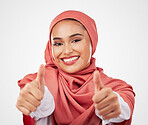 Muslim, woman and thumbs up, hands and agreement with smile in portrait isolated on white background. Hijab, opinion with communication and success, support and like emoji with vote in a studio