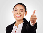 Happy business woman, portrait and thumbs up in success, winning or thank you against a studio background. Female person or employee smile with like emoji, yes sign or OK in agreement or approval