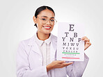 Woman, portrait and chart in eye exam, letter or vision of optometrist in healthcare or sight against a studio background. Happy doctor smile with glasses in optometry assessment, diagnosis or test