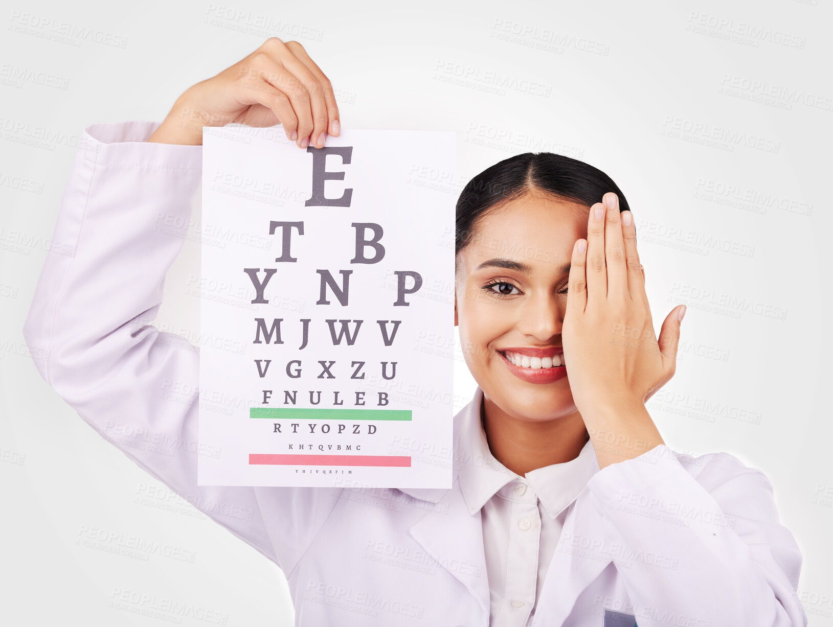 Buy stock photo Portrait, smile and eye test with a woman optician in studio on a gray background for vision or eyesight. Face, medical and a happy young doctor in a clinic or optometry office for a visual exam