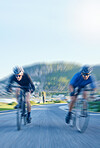 Motion blur, racing and cyclist on bicycle on road in mountain together, exercise adventure and speed. Cycling, nature and men with bike for fast workout competition, training motivation and energy.