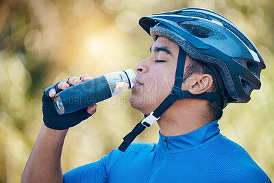 Buy stock photo Nature, cycling or man drinking water in training, workout or cardio exercise on a fitness break. Relax, fatigue or tired sports cyclist with healthy liquid for hydration after riding on woods trail