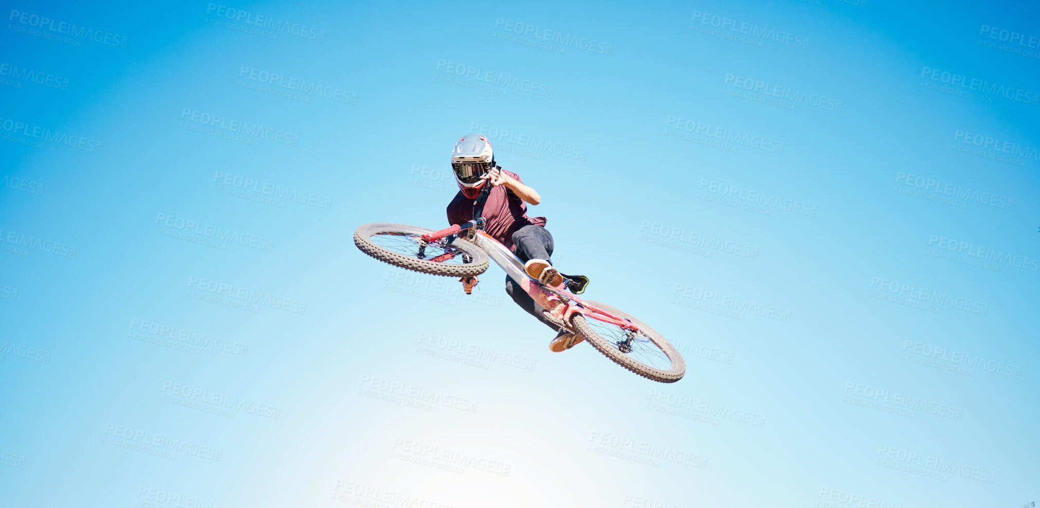 Buy stock photo Sky, cycling and a person jump outdoor for sports, workout or training with skills and stunt. Athlete or cyclist with safety, wellness and fitness or banner space with balance and bicycle in air