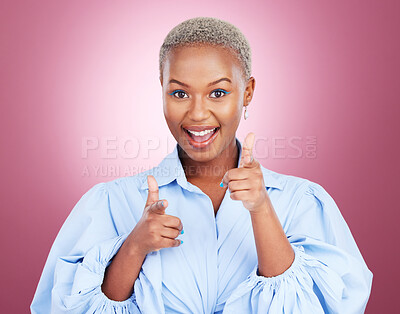 Buy stock photo Portrait, pointing and finger guns with a black woman on a pink background in studio for choice or fun. Face, smile or comedy and an excited young model with a hands emoji to vote as a winner