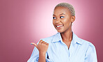 Pointing finger, smile and a woman in studio with hand for advertising, marketing or announcement. Happy face of an excited African person on pink background for choice, presentation or mockup space