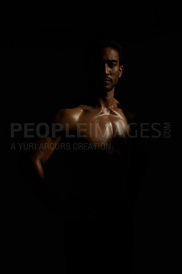 Buy stock photo Topless, muscle and portrait man in dark background for fitness inspiration, beauty aesthetic or strong body. Shadow aesthetic, topless male model or body builder in creative studio with art lighting