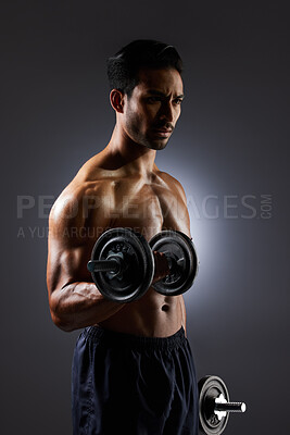 Buy stock photo Thinking, dark and a man with weights on a black background for muscle, fitness and exercise. Sports, idea and an Asian bodybuilder or strong athlete doing weightlifting for training with power