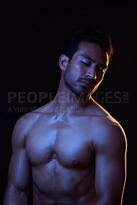 Buy stock photo Topless, dark and sexy man on black background in fitness inspiration, beauty aesthetic or strong fantasy. Bodybuilder art, body and seductive male model with muscle, studio and neon blue lighting