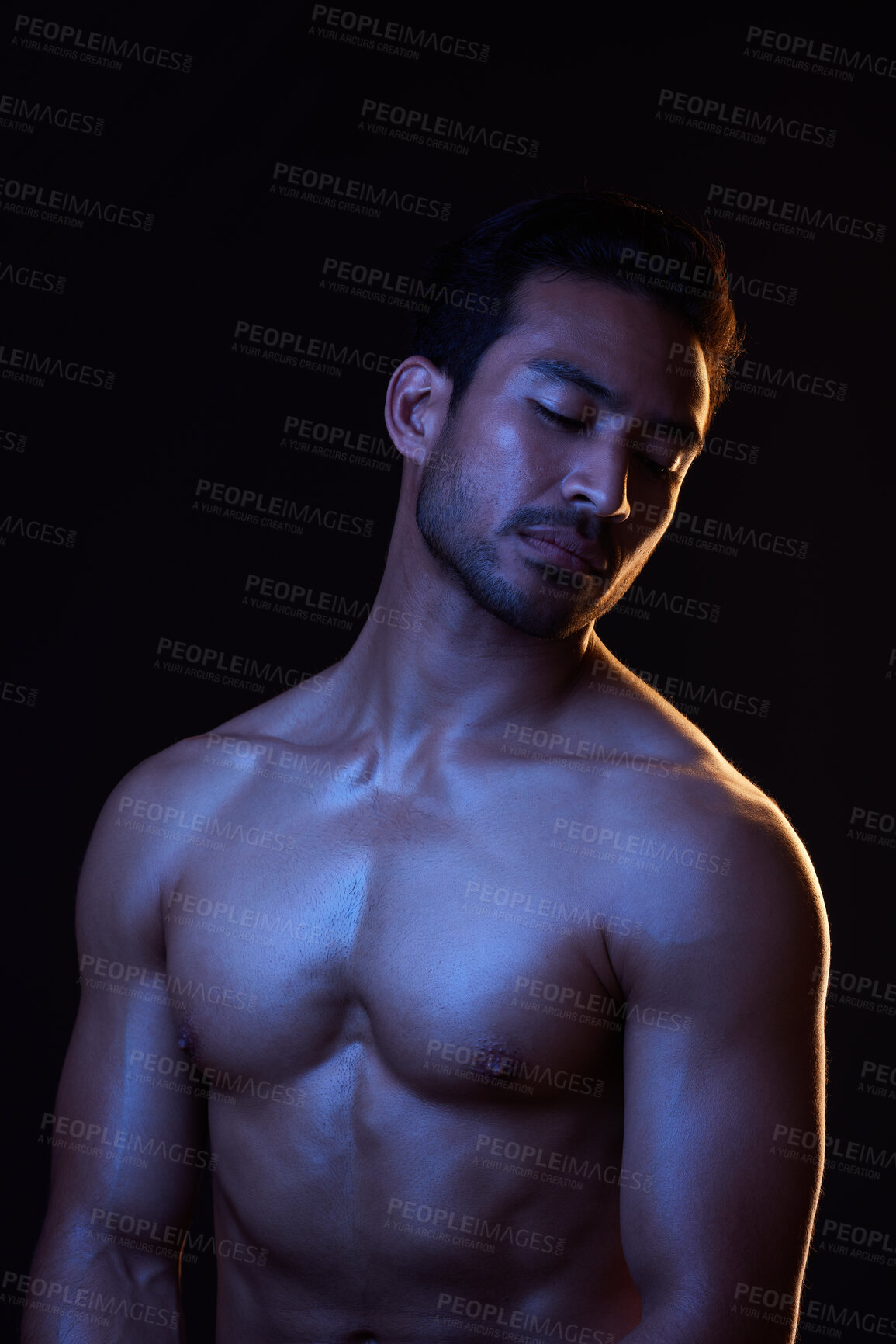 Buy stock photo Topless, dark and sexy man on black background in fitness inspiration, beauty aesthetic or strong fantasy. Bodybuilder art, body and seductive male model with muscle, studio and neon blue lighting