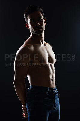 Buy stock photo Bodybuilder man, shirtless and muscle in studio for wellness, healthy body and black background. Young guy, fitness and silhouette in jeans, portrait and strong for fashion, health or topless for art