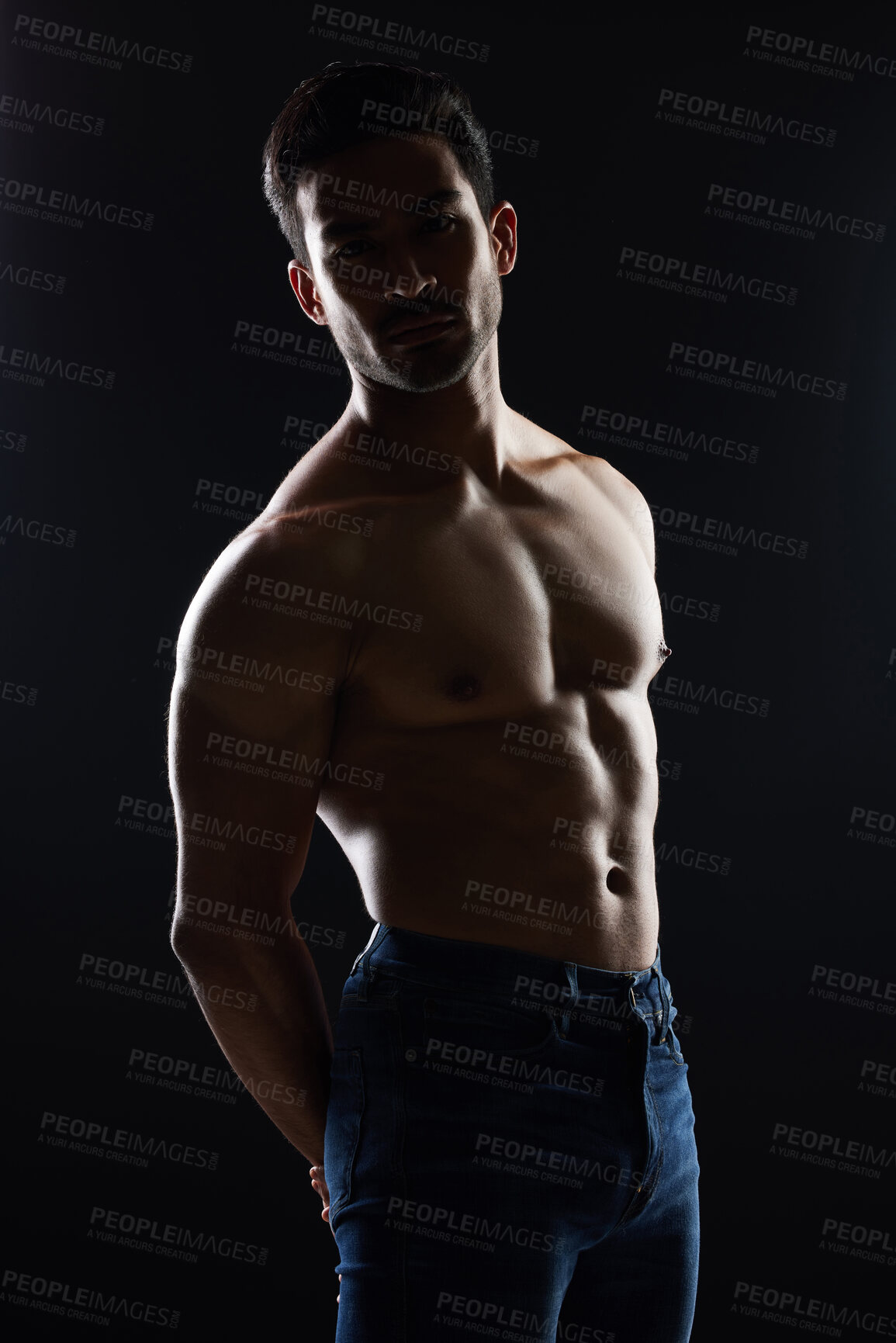 Buy stock photo Bodybuilder man, topless and muscle in studio for wellness, healthy body and black background. Young guy, fitness and silhouette in jeans, portrait and strong for fashion, shadow or shirtless for art