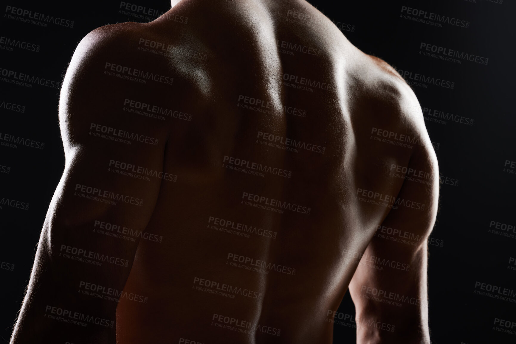 Buy stock photo Bodybuilder man, back and silhouette in studio, shadow and wellness with health, strong and black background. Model guy, muscle and shirtless for fitness with skin, aesthetic or power in dark for art
