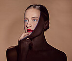 Spotlight, face and woman with makeup in shadow with dark, beauty and creative aesthetic in studio background. Light, female model and thinking about cosmetics with mystery, art or style in skincare