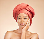 Thinking, beauty and black woman in studio with hair scarf, idea or natural cosmetic questions on brown background. Face, skincare and African lady model with head wrap, wellness or glow treatment