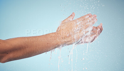 Buy stock photo Hands, cleaning and woman with soap and water in studio, blue background and healthcare mockup or skincare. Model, closeup or washing skin for clean, hygiene and protection from bacteria or virus