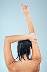 Shower, studio and woman cleaning back, hair or body for wellness on mock up space on blue background. Fresh, water or wet person washing and grooming for healthy natural hygiene or skincare to relax