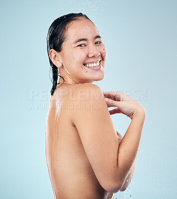 Buy stock photo Shower, portrait or happy woman cleaning body for wellness or dermatology in studio on blue background. Smile, beauty or wet girl washing or grooming for healthy natural hygiene or skincare to relax