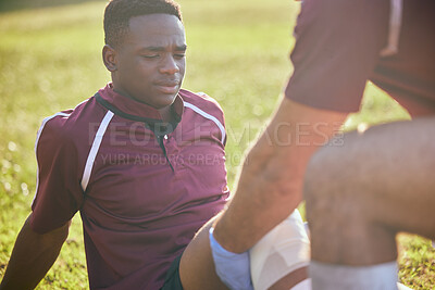 Buy stock photo First aid, sport injury and black man with soccer accident, fitness and massage on a field. Training, workout and physical therapy of knee pain at game with healthcare emergency from exercise 