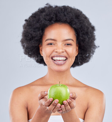 Buy stock photo Apple, black woman and portrait with beauty, diet and natural skincare glow in studio. Happy, face and fruit for healthy nutrition, grey background and wellness with smile from vegan and organic food