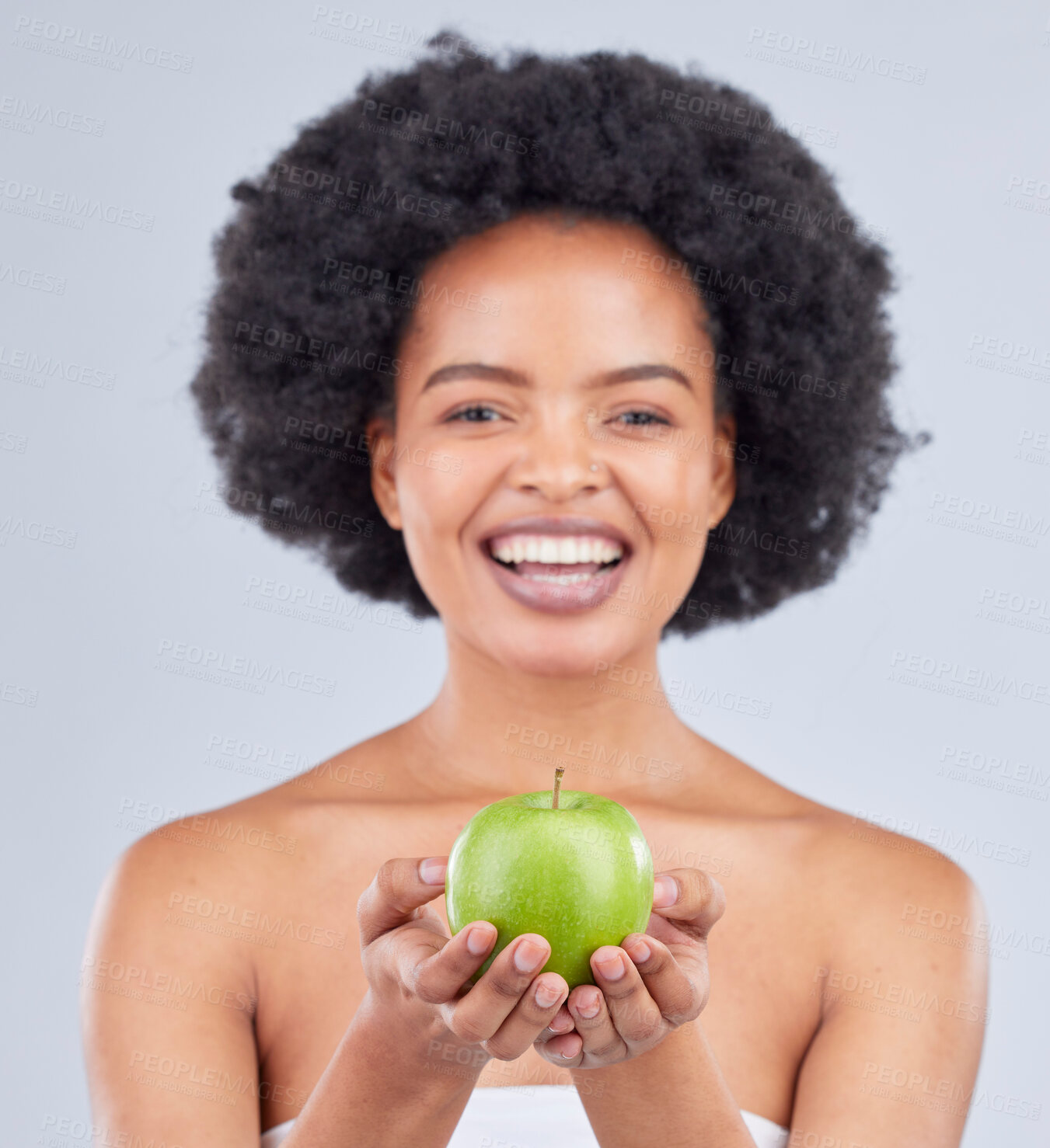 Buy stock photo Apple, black woman and portrait with beauty, diet and natural skincare glow in studio. Happy, face and fruit for healthy nutrition, grey background and wellness with smile from vegan and organic food