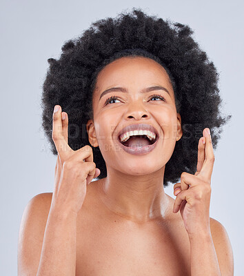 Buy stock photo Hope, luck and black woman with fingers crossed for beauty and skincare isolated in a studio gray background with smile. Notification, deal and young person excited for cosmetics with optimism