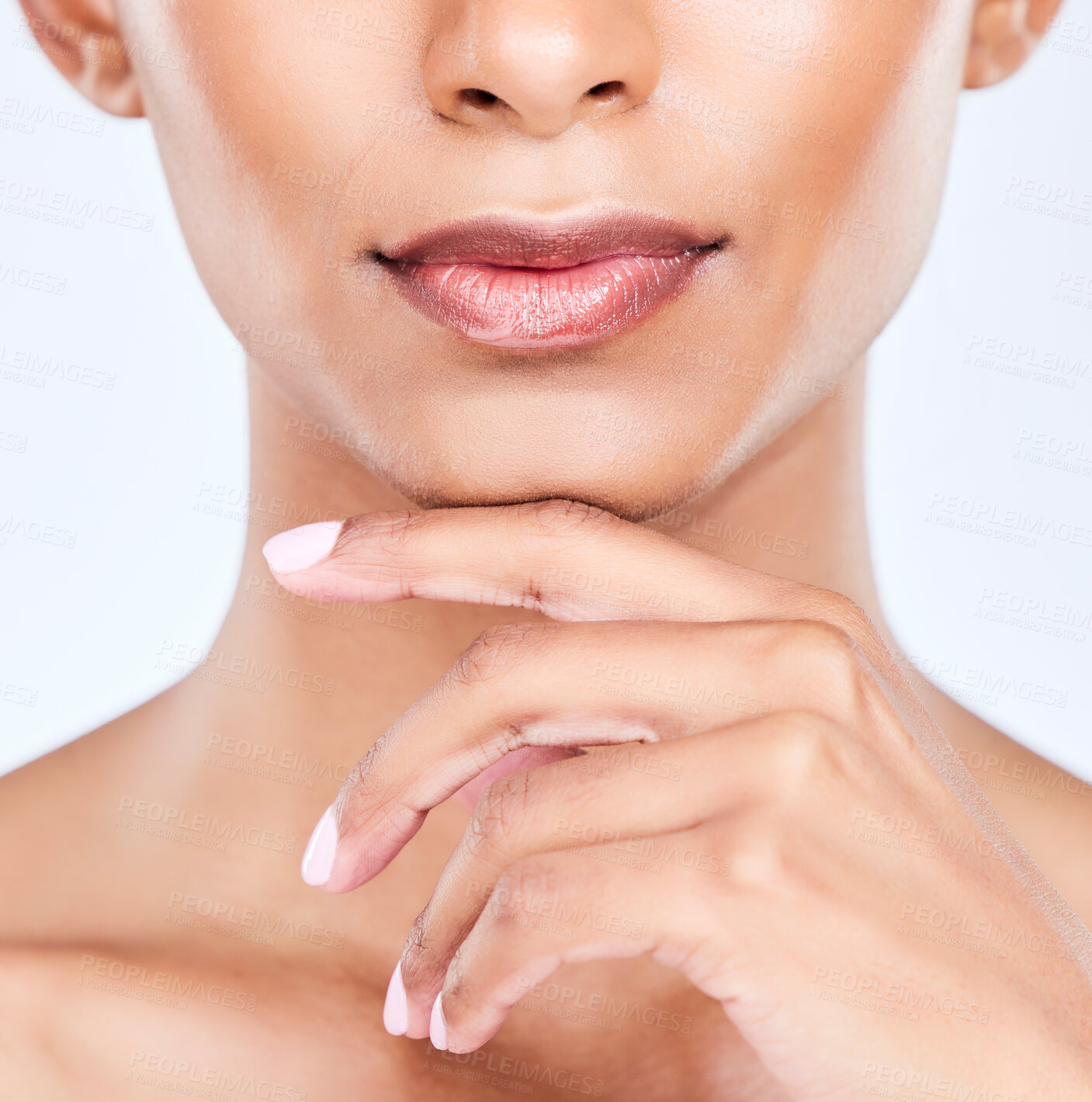 Buy stock photo Woman hand, lips and beauty closeup with makeup, face and lipstick glow in studio. Mouth, skincare and manicure of a female model with dermatology, wellness and cosmetics with white background