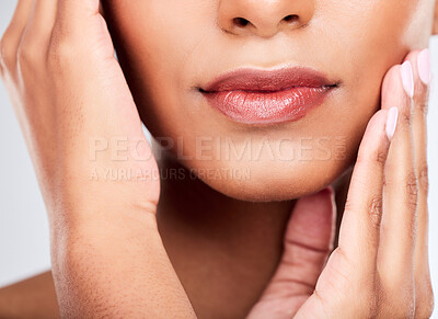 Buy stock photo Face, hands and mouth with a woman closeup in studio on a white background for beauty, skincare or natural cosmetics. Aesthetic, lips and wellness with a young model touching her healthy skin