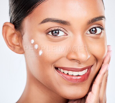 Buy stock photo Portrait, cream and woman with cosmetics, smile and dermatology on a white studio background. Face, person and model with lotion, shine or creme with skincare, moisturiser and wellness with aesthetic