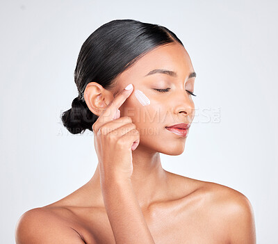 Buy stock photo Beauty, cream and woman with skincare, cosmetics or moisturiser on a white studio background. Person, dermatology or model with creme, wellness and self care with aesthetic, shine or glow with lotion