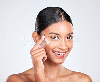 Buy stock photo Portrait, cream and woman with skincare, cosmetics and moisturiser on a white studio background. Face, person and model with aesthetic, shine and glow with beauty, self care or dermatology with creme