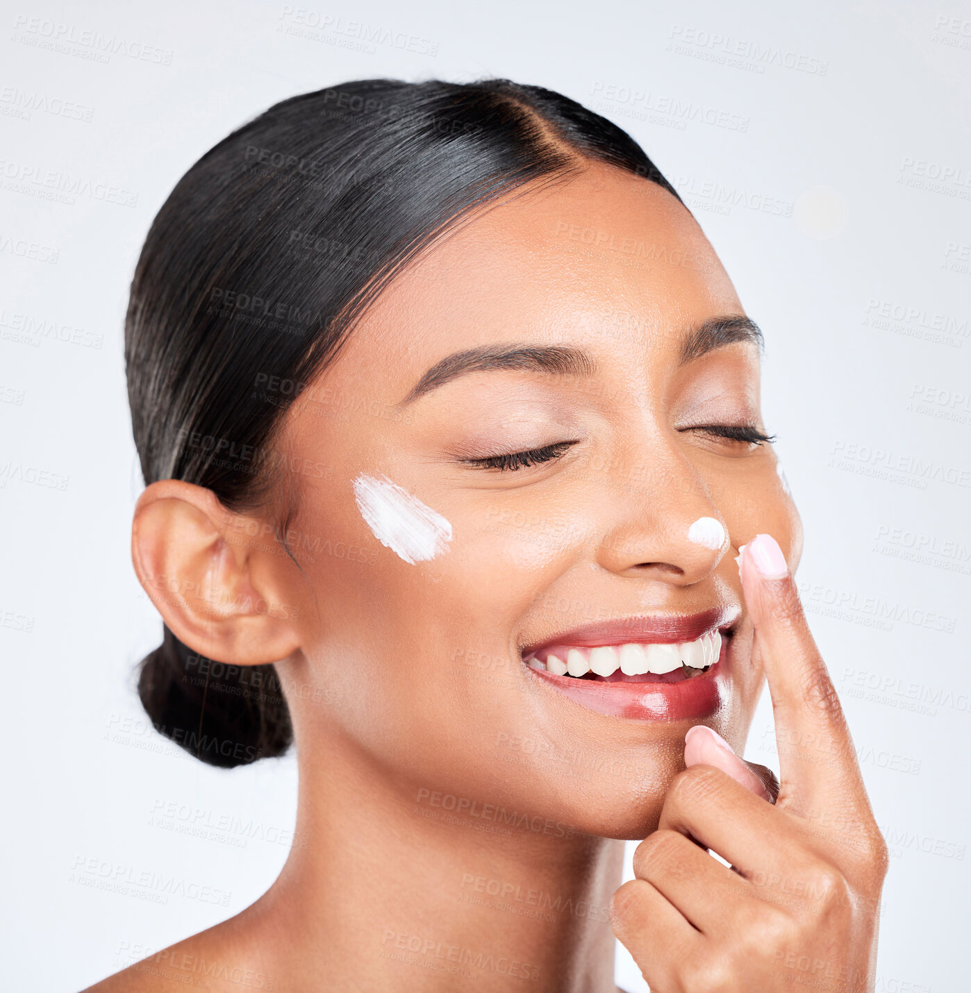 Buy stock photo Happy, cream and woman with skincare, wellness and dermatology on a white studio background. Person, self care and model with creme, shine and sunscreen with beauty, glow or aesthetic with lotion