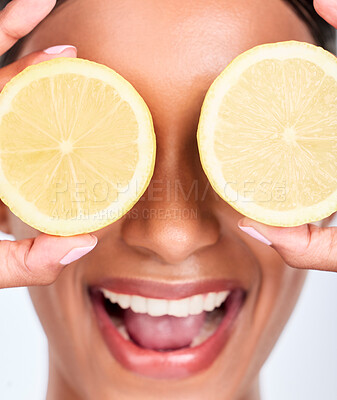 Buy stock photo Skincare, lemon and woman with cosmetics, wellness and dermatology on a white studio background. Person, girl and model with fruit, vitamin c or aesthetic with beauty, shine and smile with self care