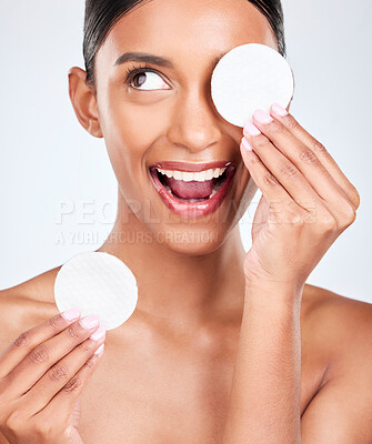 Buy stock photo Face, happy woman and cotton pad, beauty and makeup removal with skincare and clean on white background. Hygiene, excited for cosmetics and product with wellness, dermatology and skin shine in studio