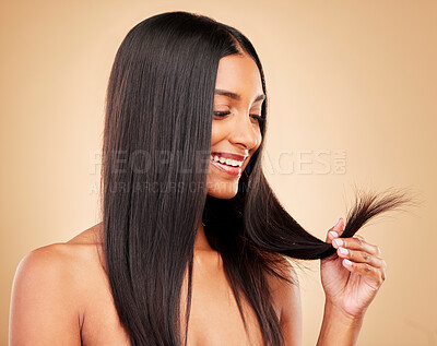Buy stock photo Hair care, wellness and portrait of woman in a studio with split ends for salon keratin treatment. Beauty, cosmetic and headshot of Indian female model with hairstyle isolated by a brown background.
