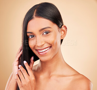 Buy stock photo Happy, hair care and portrait of woman with beauty and glow from collagen in shampoo or cosmetics on studio background. Indian, face and model with haircare, treatment or healthy texture or shine
