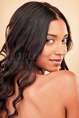Buy stock photo Hair care, beauty and face of woman in studio isolated on a brown background. Curly hairstyle, natural cosmetics and portrait of Indian model in salon treatment for growth, health and skin wellness