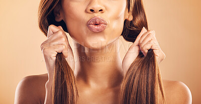 Buy stock photo Kiss, hair care and woman with beauty and strong texture with growth isolated in a studio brown background. Closeup,  skincare and person with cosmetics aesthetic or natural haircut with shampoo
