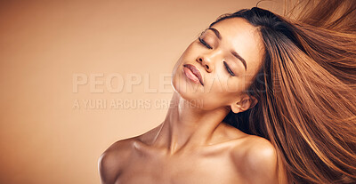 Buy stock photo Mockup, beauty and hair with a natural woman in studio on a brown background for keratin treatment. Face, space and shampoo with a confident young model at the salon for growth or aesthetic haircare