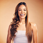 Portrait of woman, straight hair and curly, funny and isolated on a brown background in studio. Face, hairstyle and natural cosmetics of happy model in salon treatment for beauty, wellness and laugh