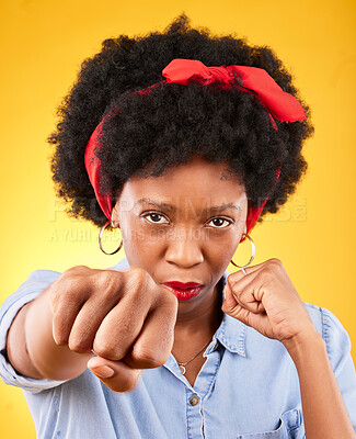 Buy stock photo Strong, fist and boxing with portrait of black woman in studio for power, motivation and energy. Empowerment, pride and champion with person on yellow background for challenge, punch and hard work