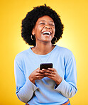 Woman, laugh and typing on smartphone in studio, reading funny social media post and mobile news on yellow background. Happy african model, cellphone and joke of meme, multimedia notification or tech
