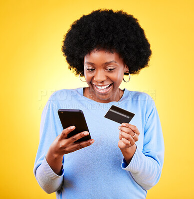 Buy stock photo Happy black woman, phone and credit card in online shopping against a yellow studio background. Excited African female person with afro smile on mobile smartphone app in ecommerce, payment or banking