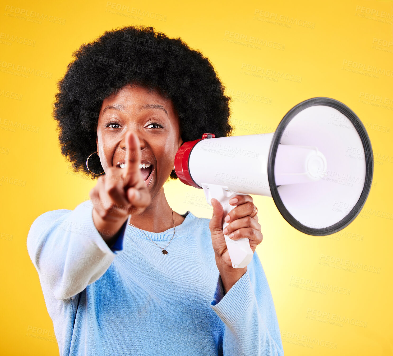 Buy stock photo Pointing, happy woman and loudspeaker or megaphone in studio for voice or announcement. African person portrait with speaker for broadcast message, breaking news or speech on yellow background
